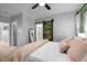 Bedroom view featuring a decorative sliding barn door leading to the en suite bathroom at 7829 Acc Blvd, Raleigh, NC 27617