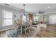 Dining area open to living space with table, chairs and decor at 7829 Acc Blvd, Raleigh, NC 27617