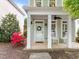 Charming front porch with rocking chairs, creating a cozy and inviting entrance to the home at 7829 Acc Blvd, Raleigh, NC 27617