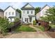 Charming two-story home featuring a cozy front porch and well-maintained lawn at 7829 Acc Blvd, Raleigh, NC 27617