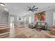 Open-concept living space with a dining area and staircase at 7829 Acc Blvd, Raleigh, NC 27617