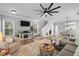 Spacious living room with staircase, tv, and dining area at 7829 Acc Blvd, Raleigh, NC 27617
