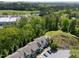 Aerial view of townhome community with mature trees and beautiful landscaping at 7851 Allscott Way, Raleigh, NC 27612