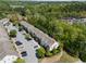 Expansive aerial view showcases the multi-story townhome, street, and lush surrounding landscape at 7851 Allscott Way, Raleigh, NC 27612