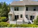 View of the townhome's backyard with a small patio and a privacy fence at 7851 Allscott Way, Raleigh, NC 27612