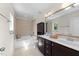 Full bathroom with double sink vanity, separate soaking tub, and tiled shower for added luxury at 7851 Allscott Way, Raleigh, NC 27612