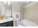 Bathroom featuring neutral tile and black fixtures at 7851 Allscott Way, Raleigh, NC 27612