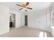 Bedroom featuring neutral carpeting, closet storage, and an en suite bathroom at 7851 Allscott Way, Raleigh, NC 27612