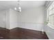 Dining area featuring hardwood floors and natural light at 7851 Allscott Way, Raleigh, NC 27612