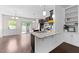 Open kitchen features granite countertops, stainless steel appliances, and a convenient breakfast bar at 7851 Allscott Way, Raleigh, NC 27612
