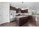 Well-equipped kitchen featuring stainless steel appliances and a center island at 7851 Allscott Way, Raleigh, NC 27612