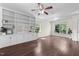 Bright living room featuring hardwood floors, built-in shelving, and natural light at 7851 Allscott Way, Raleigh, NC 27612