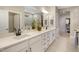Bathroom with dual sinks, quartz countertop, and ample counter space at 825 Flower Manor Dr, Wendell, NC 27591