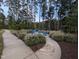 Cozy outdoor fire pit area with Adirondack chairs, ideal for relaxation and socializing at 825 Flower Manor Dr, Wendell, NC 27591