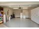 A spacious garage with epoxy flooring and plenty of storage and room for parking two vehicles at 825 Flower Manor Dr, Wendell, NC 27591