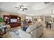 Spacious living room featuring an entertainment center, wood laminate flooring, and neutral walls at 825 Flower Manor Dr, Wendell, NC 27591