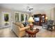 Cozy living room with large windows, comfortable seating, and stylish decor at 825 Flower Manor Dr, Wendell, NC 27591