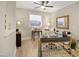 Airy home office featuring neutral walls, wood laminate flooring, and an ornate gold mirror at 825 Flower Manor Dr, Wendell, NC 27591