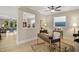 A light filled office space featuring a modern desk, stylish decor, and wood laminate flooring at 825 Flower Manor Dr, Wendell, NC 27591