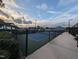 Well-maintained community tennis court with fencing and benches at 825 Flower Manor Dr, Wendell, NC 27591