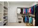 Spacious walk-in closet with custom shelving, hanging rods, and ample storage space at 825 Flower Manor Dr, Wendell, NC 27591