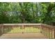 Enjoy the view from this well-maintained wooden back deck surrounded by nature at 919 Orient St, Durham, NC 27701