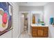 Bathroom boasts modern vanity, mirror with lighting, and a doorway view to the toilet at 919 Orient St, Durham, NC 27701