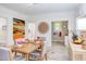Dining room with table set for four and a view into the kitchen at 919 Orient St, Durham, NC 27701