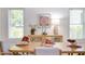 Dining room setting showcasing a wooden buffet and natural light from bright windows at 919 Orient St, Durham, NC 27701