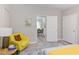 Comfortable main bedroom with stylish decor, doorway view to dining area, and wood-look floors at 919 Orient St, Durham, NC 27701