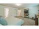 Spacious bedroom featuring a TV, dresser, and neutral carpet, creating a comfortable and functional space at 101 Yuma Dr, Louisburg, NC 27549