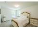 Cozy bedroom with neutral color scheme, carpeted floors, and natural light from the windows at 101 Yuma Dr, Louisburg, NC 27549