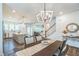 Dining area with views of the kitchen, living room, and staircase, creating a cohesive and spacious living space at 101 Yuma Dr, Louisburg, NC 27549
