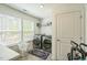 Efficient laundry room with front-load washer and dryer, bright windows, and ample storage at 101 Yuma Dr, Louisburg, NC 27549