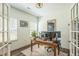 Comfortable home office with a wood desk, dual monitors, natural light, and a stylish rug at 101 Yuma Dr, Louisburg, NC 27549