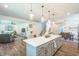Spacious open concept with kitchen island, dining area, living room, and staircase creates a comfortable living space at 101 Yuma Dr, Louisburg, NC 27549