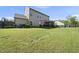Spacious backyard with green lawn, wooden fence, and room for outdoor activities at 1010 Smoke Willow Way, Rolesville, NC 27571