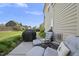 Backyard patio featuring comfortable seating, perfect for outdoor dining and relaxation at 1010 Smoke Willow Way, Rolesville, NC 27571