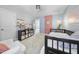 Inviting bedroom featuring a daybed, TV, and a cozy reading nook with natural light at 1010 Smoke Willow Way, Rolesville, NC 27571