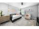Comfortable bedroom with daybed, soft chair, neutral tones, and natural light from the window at 1010 Smoke Willow Way, Rolesville, NC 27571