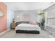 Cozy bedroom with a daybed, hanging plants, and light-colored walls enhancing the room's brightness at 1010 Smoke Willow Way, Rolesville, NC 27571