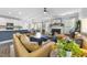 Open-concept living space with hardwood floors, fireplace, and plenty of natural light at 1010 Smoke Willow Way, Rolesville, NC 27571