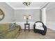Bright living room with wood floors, fresh paint, attractive furniture arrangement and abundant natural light at 1010 Smoke Willow Way, Rolesville, NC 27571