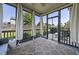 Relaxing screened porch with comfortable seating and pleasant outdoor views at 1010 Smoke Willow Way, Rolesville, NC 27571