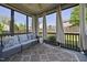 Relaxing screened porch with comfortable seating and a view of the backyard at 1010 Smoke Willow Way, Rolesville, NC 27571