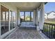 Relaxing screened-in porch with comfortable seating and views of the backyard at 1010 Smoke Willow Way, Rolesville, NC 27571