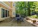 Backyard outdoor space with shade, a grill, and a table for entertaining at 102 Treadwell Ct, Cary, NC 27513