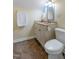 Cozy bathroom featuring neutral finishes, a pedestal sink, and a tile floor at 102 Treadwell Ct, Cary, NC 27513