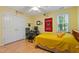Well-lit bedroom featuring natural light, a desk area, and comfortable furnishings at 102 Treadwell Ct, Cary, NC 27513