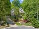 Two-story home with charming curb appeal, lush landscaping, a welcoming front porch and an inviting walkway at 102 Treadwell Ct, Cary, NC 27513